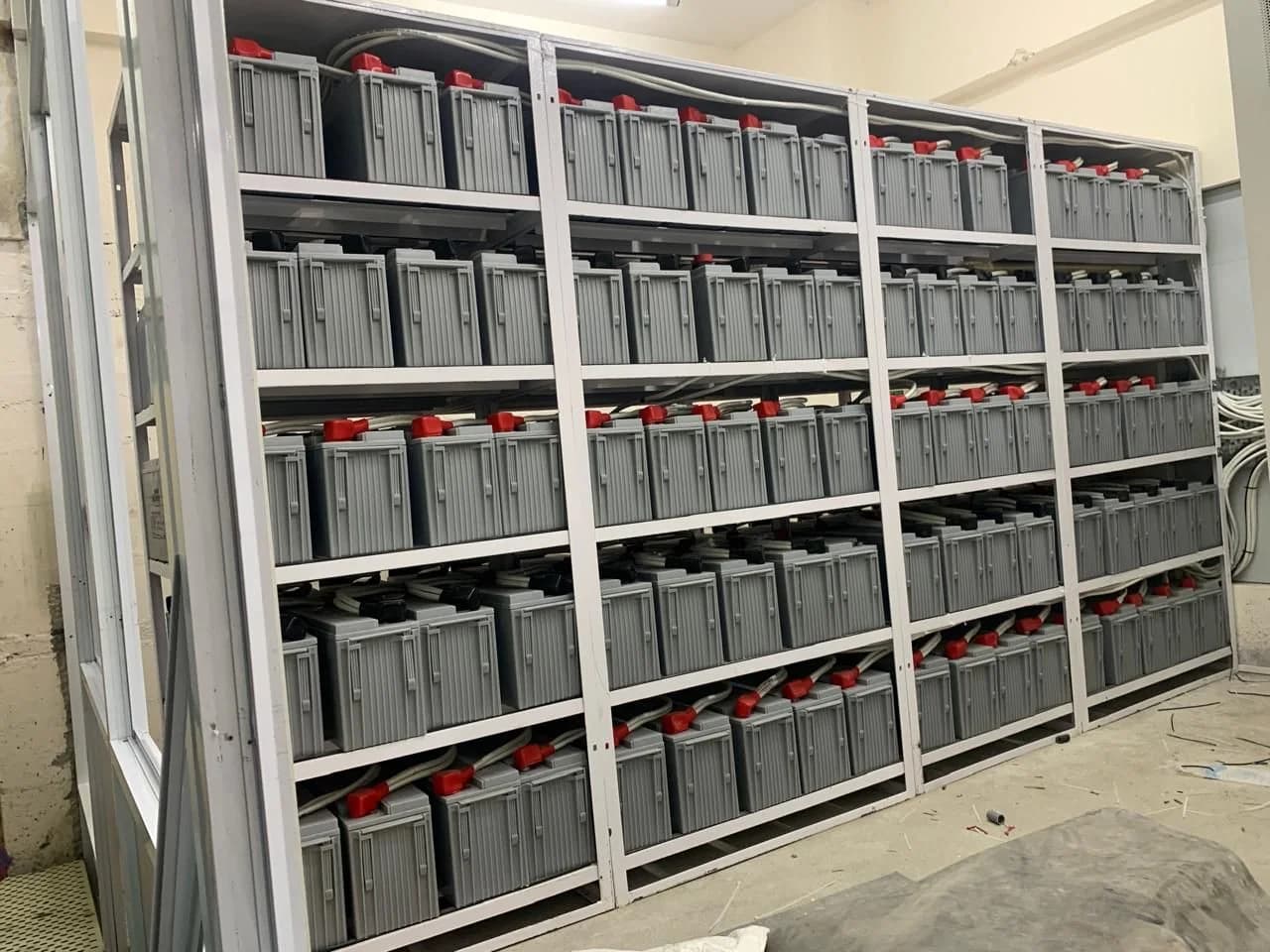 Battery rack installation shown in a supplied reference image